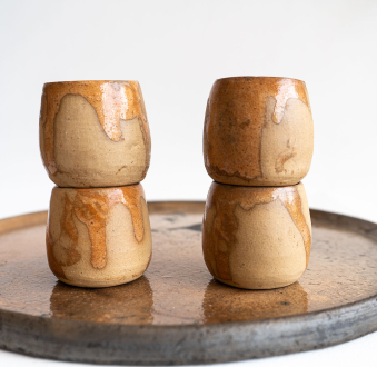 Two traditional jicama cups for drinking mezcal in Mexico, on their  rodete stands. Cups made from